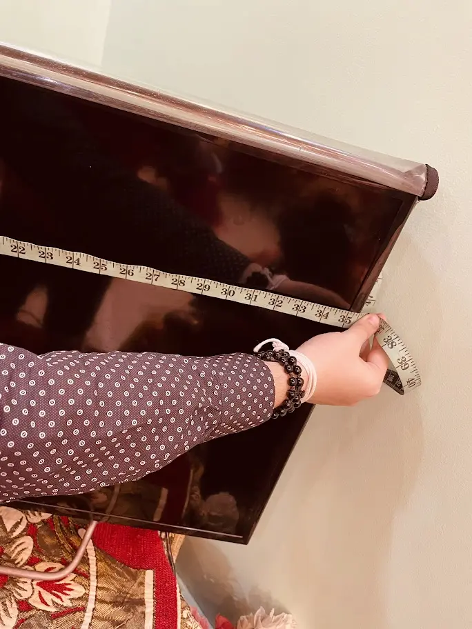 Image of Measuring the 40 inch Sony TV's Width